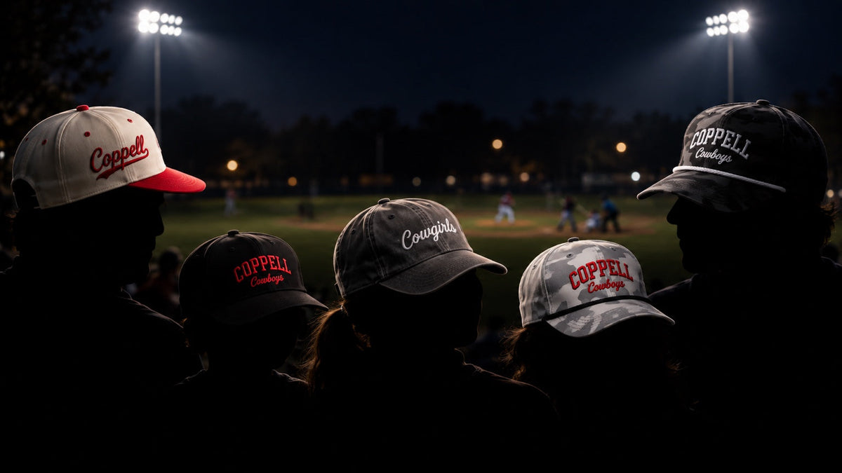 Community Hats illuminated by stadium lights during a Coppell night baseball game